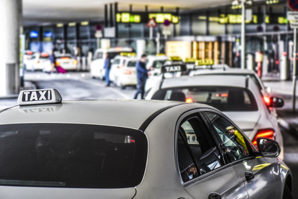Taxi car on a street of airport. Many taxi cars waiting for customers.